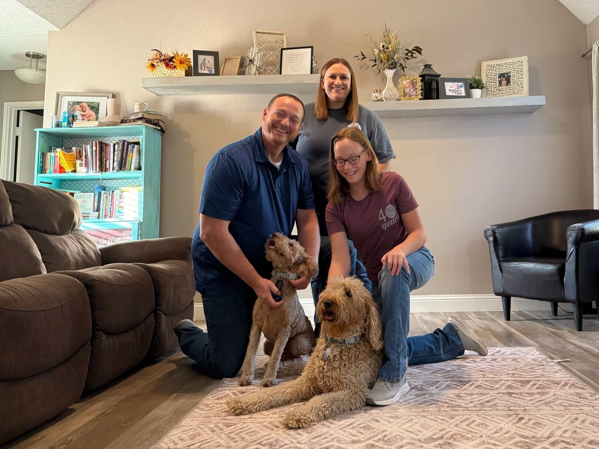 The Gentry family — Jessica, Jeff, and Layla with their Goldendoodles